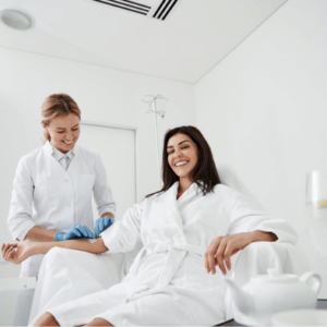 A Lady in a White Color Robe Being Pampered